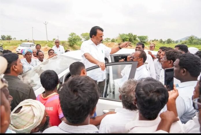 Minister Jupalli Krishna Rao is surrounded by his own party workers