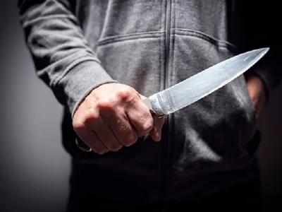 Attacked three men with knives