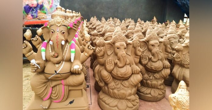 Distribution of Clay Ganeshas under the aegis of Lions Club