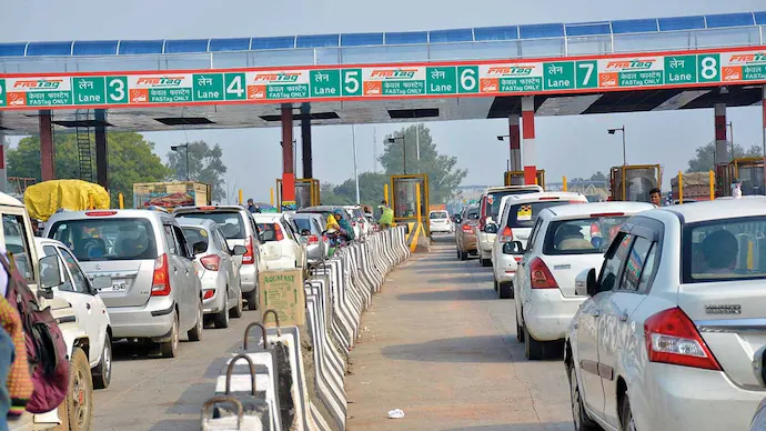 Vehicles lined up at toll plazas Vehicles lined up at toll plazas